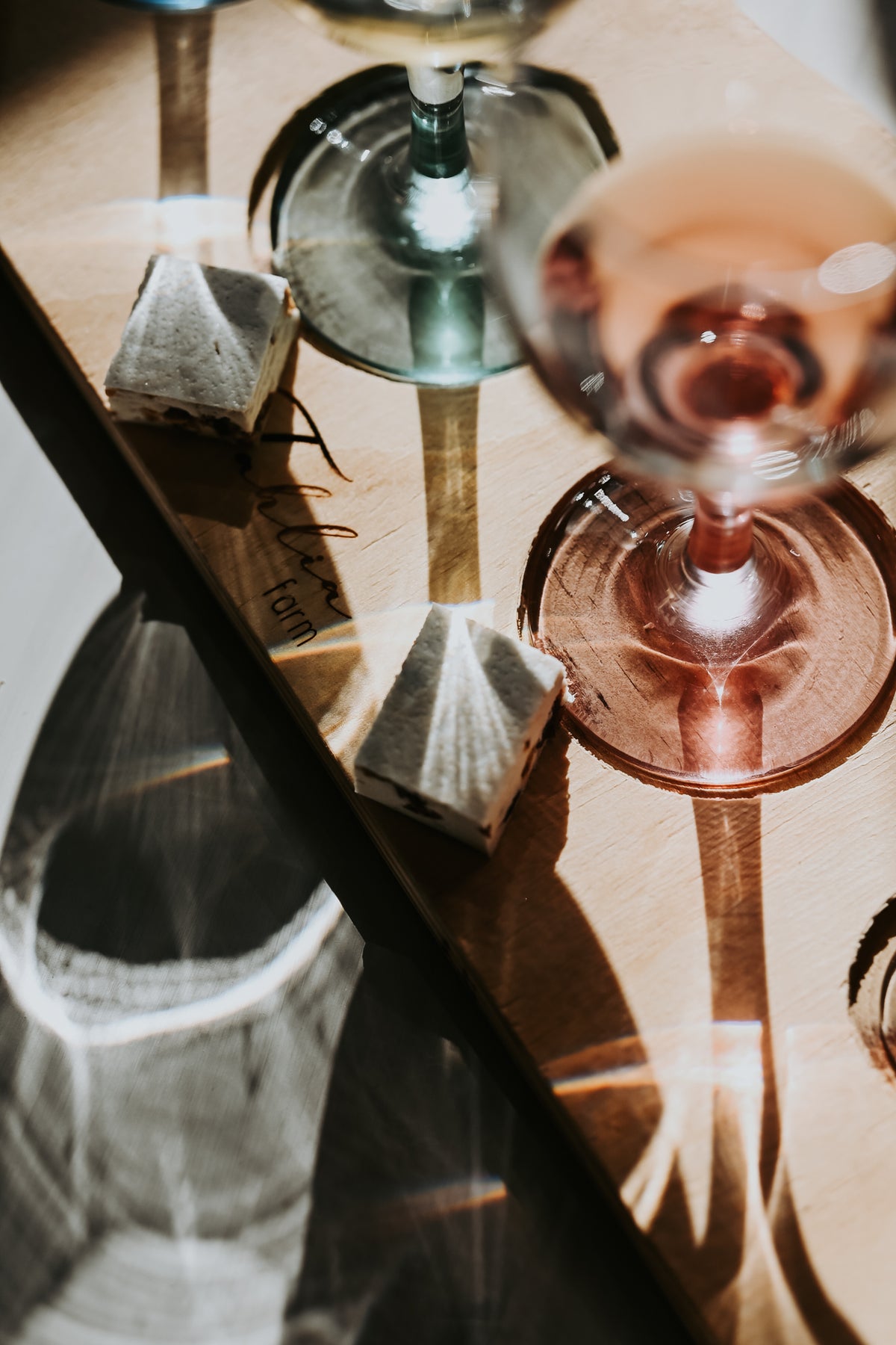 Tasting glasses on a Tahlia Farm tasting board