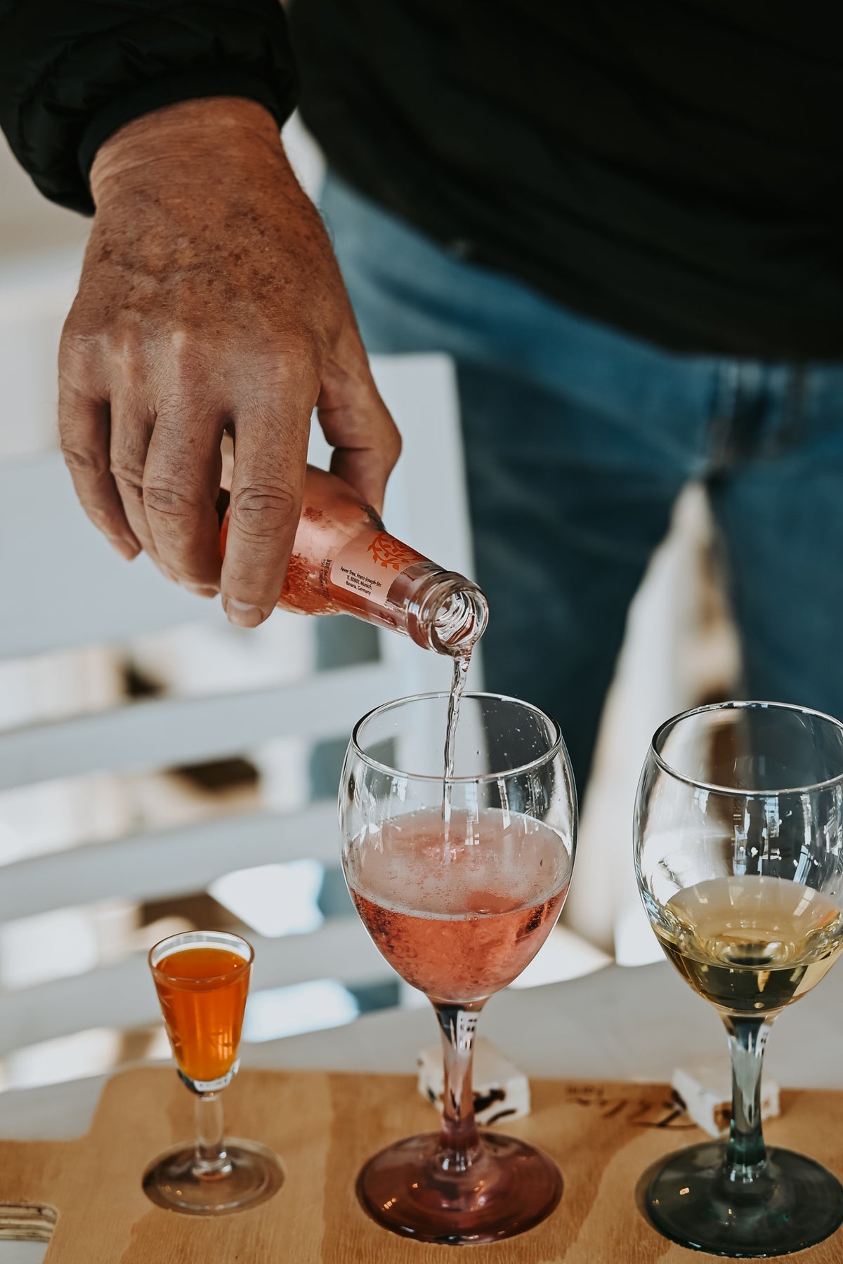 Tonic being poured into a gin tasting glass
